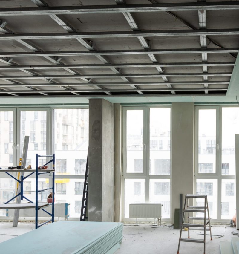 Construction worker, making walls from gypsum plasterboard or drywall. High quality photo